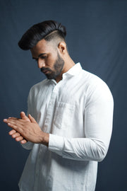 DESCRIPTION An organic cotton shirt that's oh-so-prefect for casual and formal look, pair it with airy tourers or formal you will look handsome.  100% Handmade by Indian artisans Material: 100% cotton  Our fabrics are pre-washed and dried to eliminate shrinkage. Made in India  SIZE & FIT Fit: Regular  Height: 5'11" Size: 44  COMPOSITION & CARE Gentle machines wash cold with similar colors. Do not Bleach. Do not Soak. Tumble Dry Low. Iron if required.