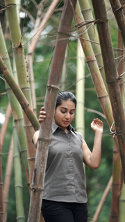 Woman wearing Etehas pure cotton grey sleeveless formal shirt  