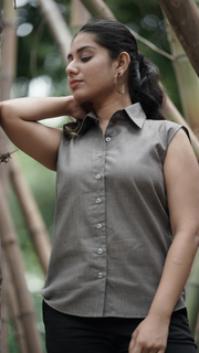 Woman wearing Etehas pure cotton grey sleeveless formal shirt  