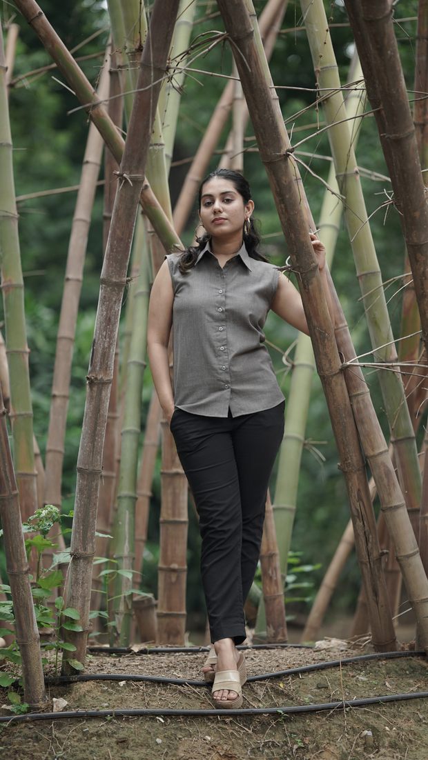 Woman wearing Etehas pure cotton grey sleeveless formal shirt  